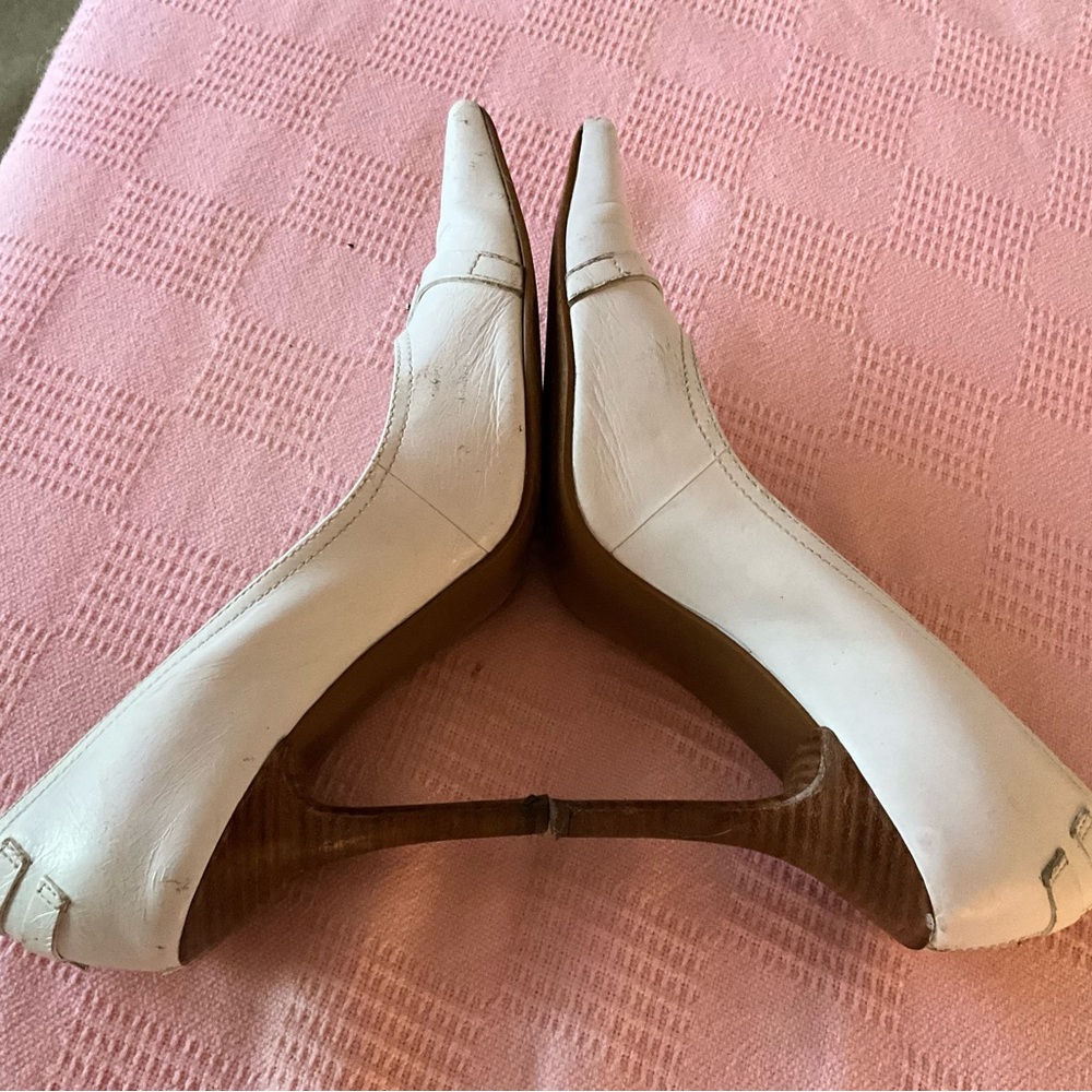 White pumps with embellishments
